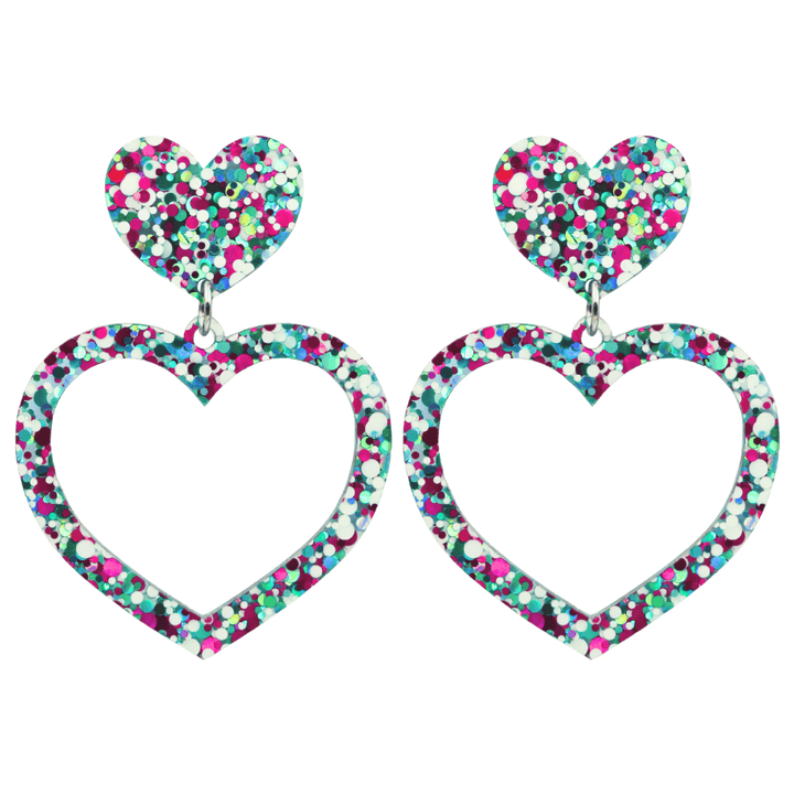 haus of dizzy confetti barbie heart earrings with white aqua and magenta glitter through a clear base size large