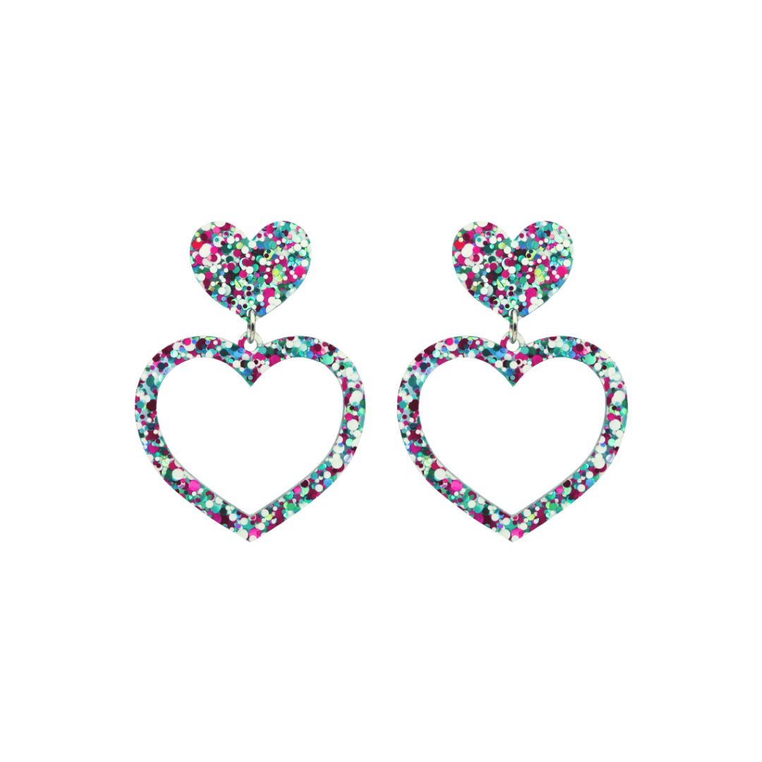 haus of dizzy confetti barbie heart earrings with white aqua and magenta glitter through a clear base size small