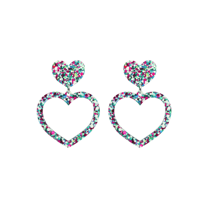 haus of dizzy confetti barbie heart earrings with white aqua and magenta glitter through a clear base size small