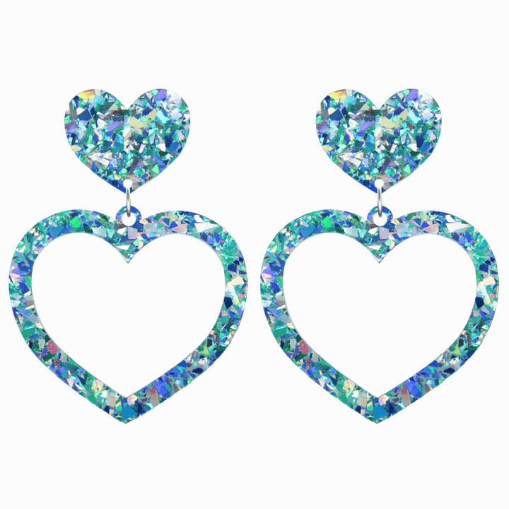 haus of dizzy crystal barbie hearts in aquamarine size large. hearts are filled with blue holographic foil/glitter