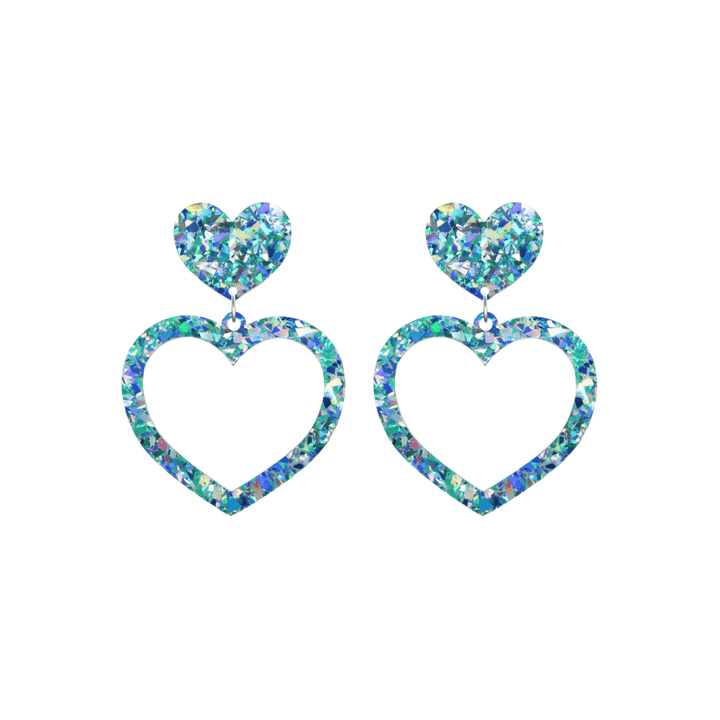 haus of dizzy crystal barbie hearts in aquamarine size small. hearts are filled with blue holographic foil/glitter