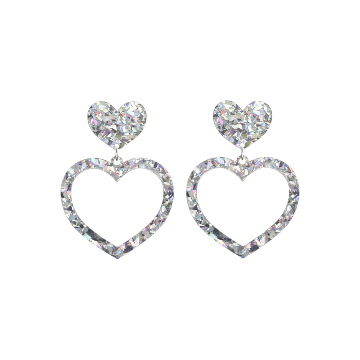 haus of dizzy crystal barbie hearts in clear quartz size small. hearts are filled with silver/clear holographic foil/glitter