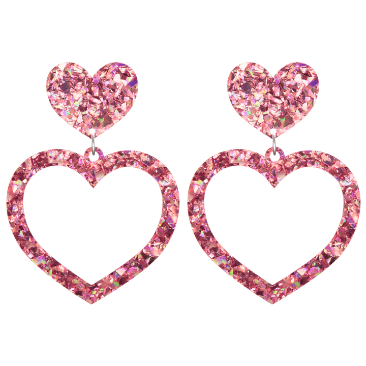haus of dizzy crystal barbie hearts in rose quartz size large. hearts are filled with pink holographic foil/glitter