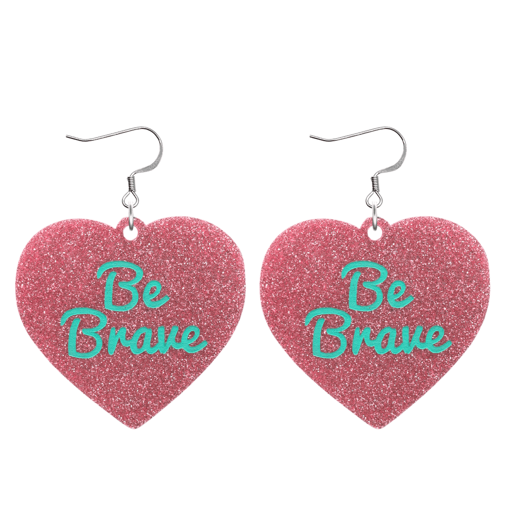 haus of dizzy baby pink glitter heart-shaped acrylic earrings with turquoise 'Be Brave' text and silver hooks no heart tops size large