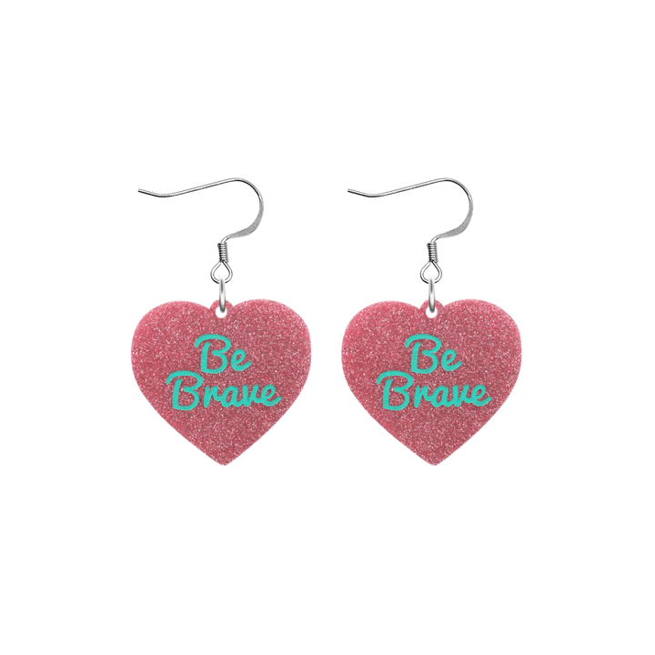 haus of dizzy baby pink glitter heart-shaped acrylic earrings with turquoise 'Be Brave' text and silver hooks no heart tops size small