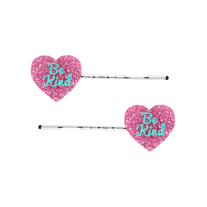 haus of dizzy two pink glitter heart-shaped acrylic pieces with aqua 'Be Kind' text on silver bobby hair pins
