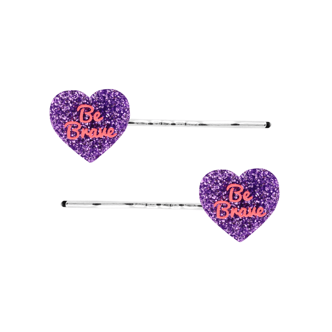 haus of dizzy two purple glitter heart-shaped acrylic pieces with red 'Be Brave' text on silver bobby hair pins