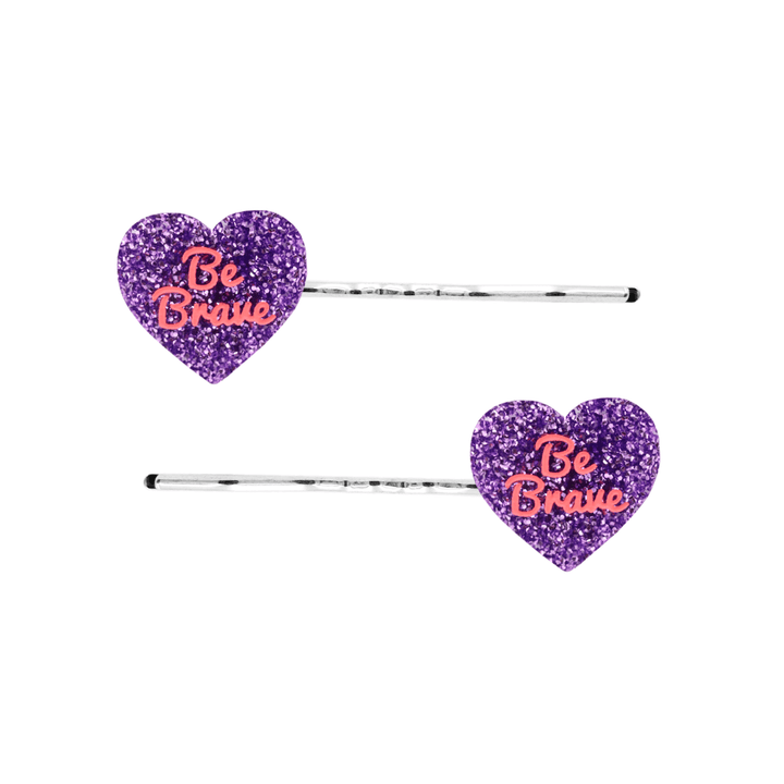 haus of dizzy two purple glitter heart-shaped acrylic pieces with red 'Be Brave' text on silver bobby hair pins