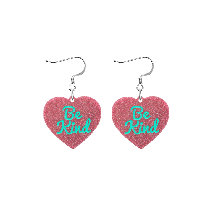 haus of dizzy baby pink glitter heart-shaped acrylic earrings with turquoise 'Be Kind' text and silver hooks no heart tops size small
