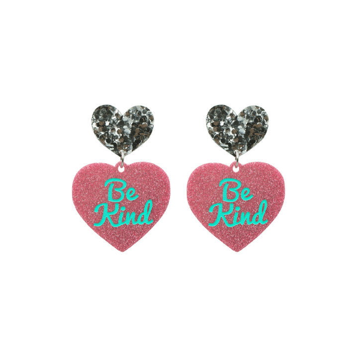 haus of dizzy baby pink glitter heart-shaped acrylic earrings with turquoise 'Be Kind' text and chunky silver glitter heart tops size small
