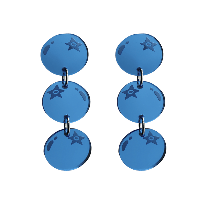 An image of Haus of Dizzy's berry blue earrings, three-tier blueberry-shaped dangle earrings, with mirror blue acrylic. 
