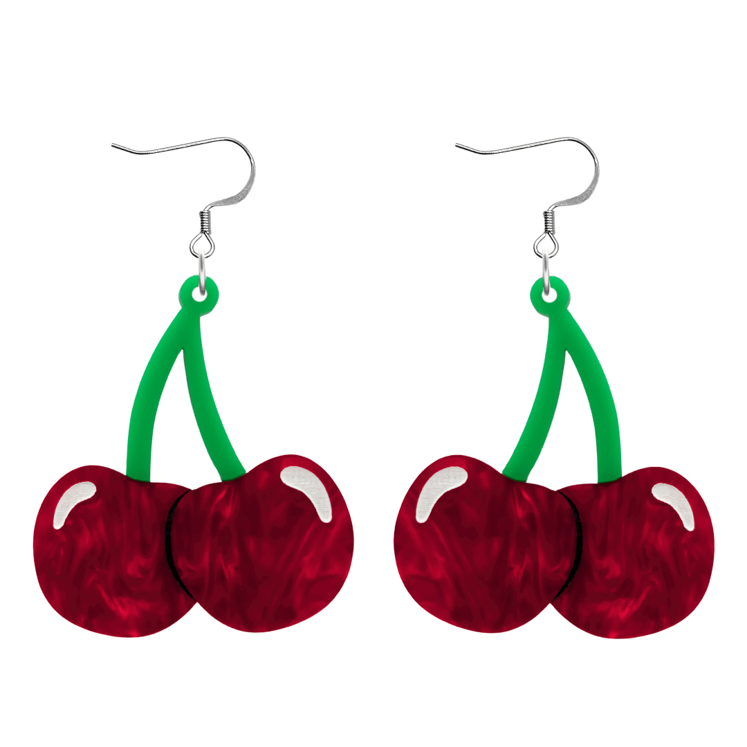 An image of Haus of Dizzy's cherry bomb earrings, large cherry-shaped dangle earrings, with red and green acrylic with white and black paint fill and hook top.
