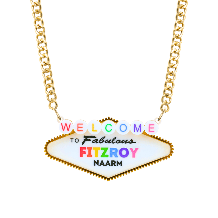 haus of dizzy necklace with a custom 'Welcome to Fabulous Fitzroy Naarm' sign pendant, featuring colorful lettering on gold chain