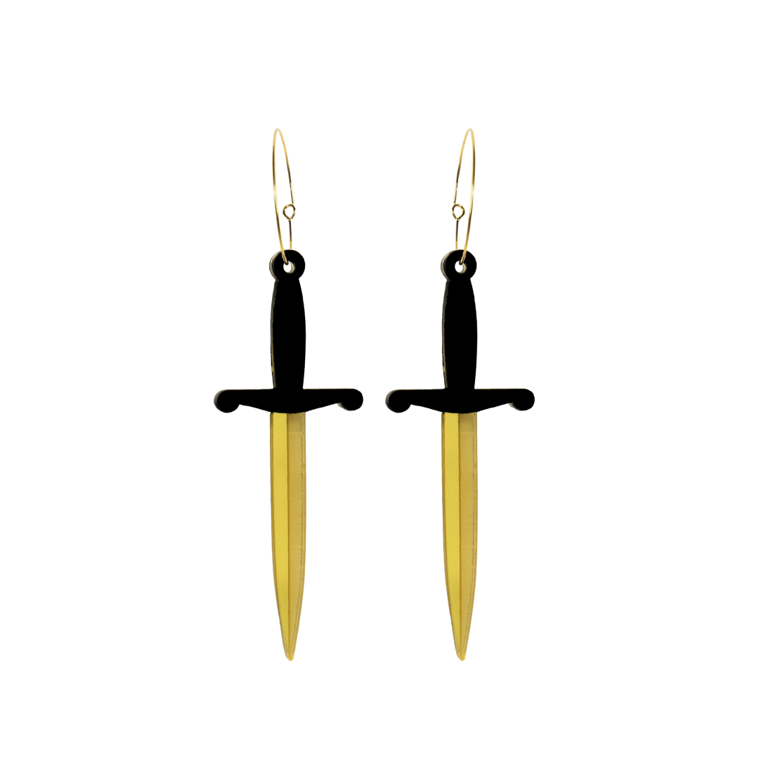 Haus of dizzy dagger sword shaped earrings with black handles and gold blades on a white background