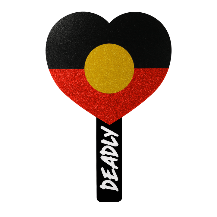haus of dizzy heart-shaped handheld mirror with a black, red, and yellow glitter acrylic for the aboriginal flag, with a black handle with hand-painted white 'DEADLY' in graffiti font. back view, size large