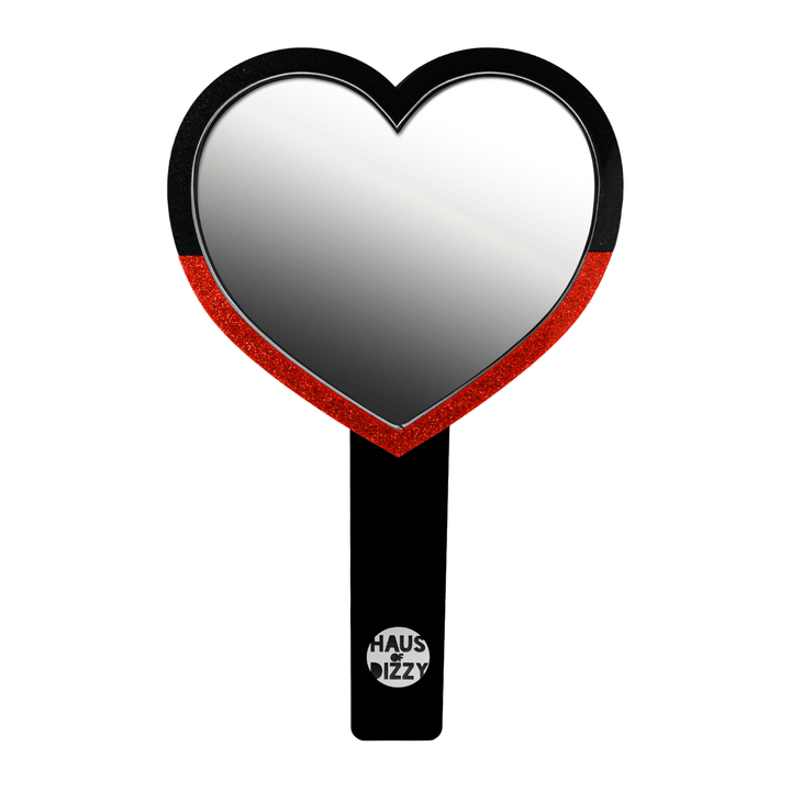 haus of dizzy heart-shaped handheld mirror, with a black handle with haus of dizzy silver logo at bottom of handle. front view, size large