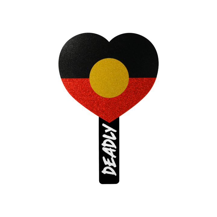 haus of dizzy heart-shaped handheld mirror with a black, red, and yellow glitter acrylic for the aboriginal flag, with a black handle with hand-painted white 'DEADLY' in graffiti font. back view, size small
