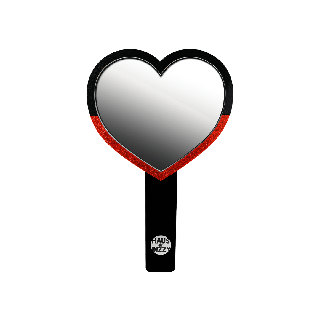 haus of dizzy heart-shaped handheld mirror, with a black handle with haus of dizzy silver logo at bottom of handle. front view, size small
