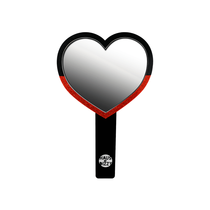 haus of dizzy heart-shaped handheld mirror, with a black handle with haus of dizzy silver logo at bottom of handle. front view, size small