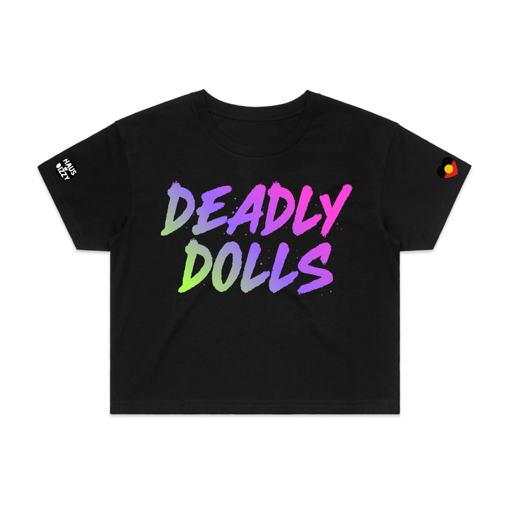 image of haus of dizzy black short-sleeve crop top t-shirt featuring the words 'DEADLY DOLLS' printed in a bold rainbow gradient brush-stroke font across the chest. haus of dizzy logo decal on right sleeve and aboriginal heart flag decal on left sleeve.