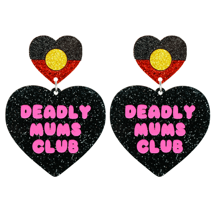 haus of dizzy earrings with a black glittery acrylic heart shape body with the phrase 'deadly mums club' hand painted in hot pink and an aboriginal flag heart stud top size large