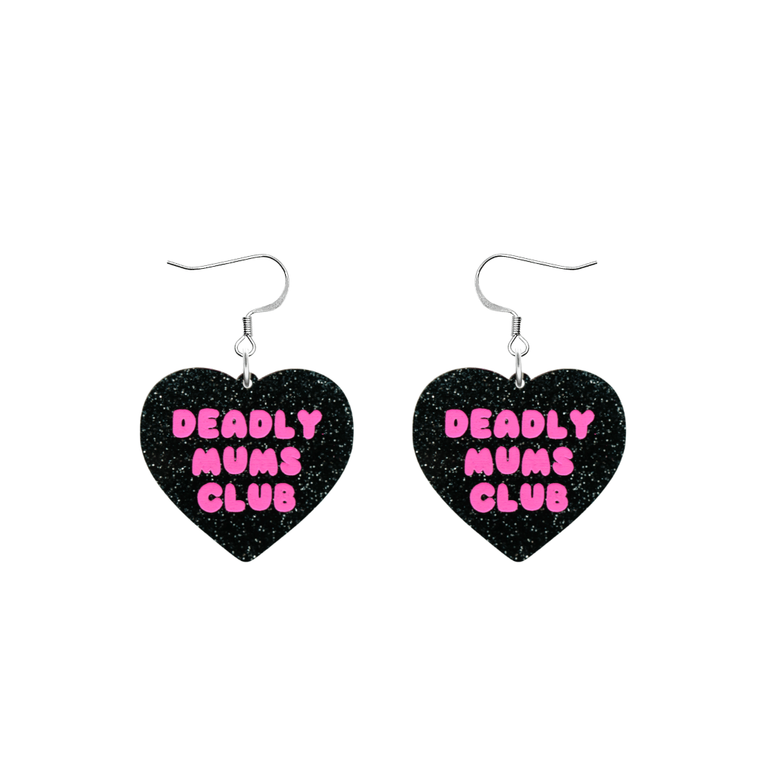 haus of dizzy earrings with a black glittery acrylic heart shape body with the phrase 'deadly mums club' hand painted in hot pink with hooks no heart tops size small