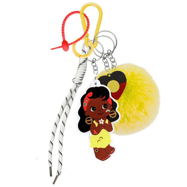 haus of dizzy dizzy chicks deluxe bag charm essie. features yellow carabiner, red rubber zip tie, yellow circle clip, white rope, yellow fluffy pom pom, acrylic glitter aboriginal flag heart charm, and printed acrylic essie dizzy chick piece