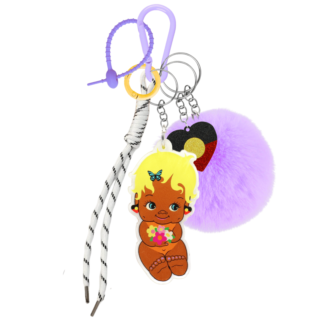 haus of dizzy dizzy chicks deluxe bag charm esme. features purple carabiner, purple rubber zip tie, yellow circle clip, white rope, lilac fluffy pom pom, acrylic glitter aboriginal flag heart charm, and printed acrylic jedda dizzy chick piece