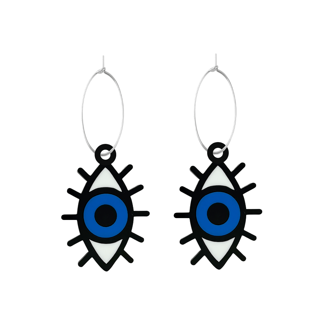 Pair of eye-shaped earrings on hoops with blue centers on a white background