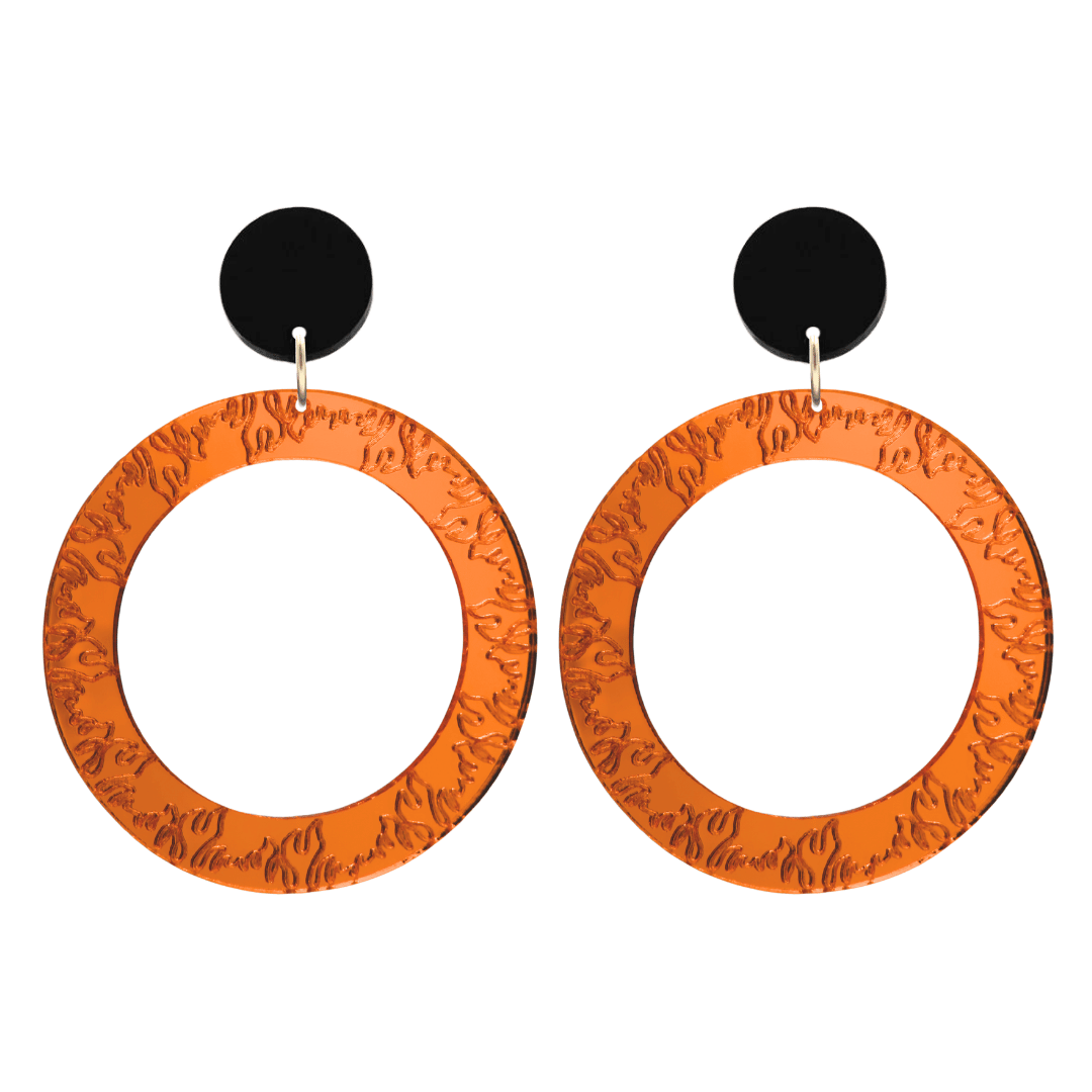 haus of dizzy orange mirror acrylic hoop earrings with flames engraved around hoop size large with black circle stud tops