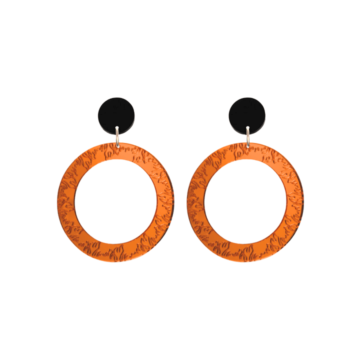 haus of dizzy orange mirror acrylic hoop earrings with flames engraved around hoop size small with black circle stud tops