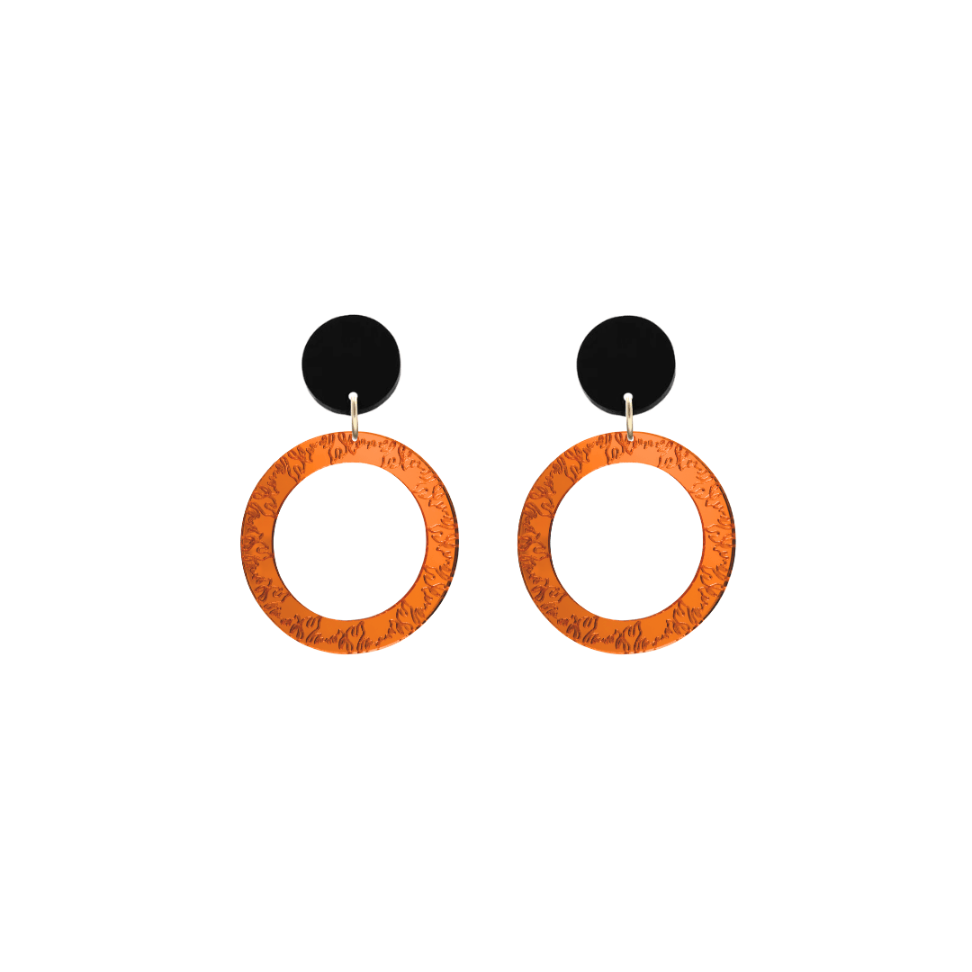 haus of dizzy orange mirror acrylic hoop earrings with flames engraved around hoop size extra small with black circle stud tops