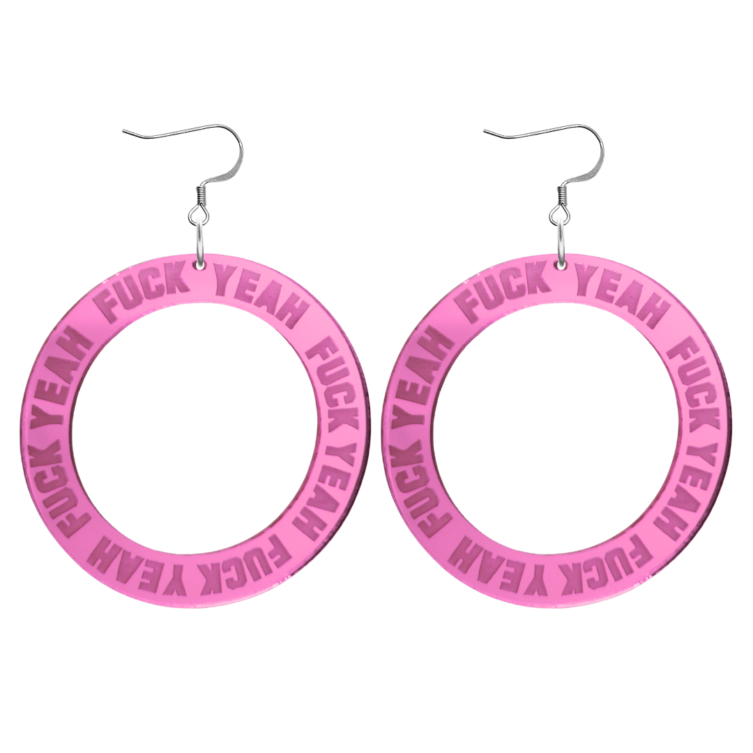 haus of dizzy pink mirror acrylic hoop earrings with 'F**K YEAH' text engraved around hoop size large with silver hooks no stud tops