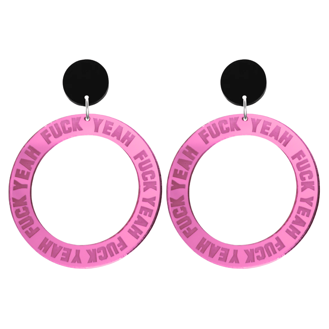 haus of dizzy pink mirror acrylic hoop earrings with 'F**K YEAH' text engraved around hoop size large with black circle stud tops