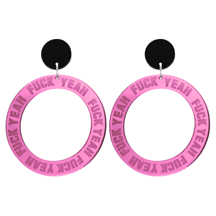haus of dizzy pink mirror acrylic hoop earrings with 'F**K YEAH' text engraved around hoop size large with black circle stud tops