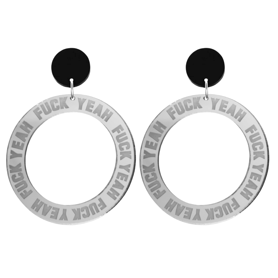 haus of dizzy silver mirror acrylic hoop earrings with 'F**K YEAH' text engraved around hoop size large with black circle stud tops