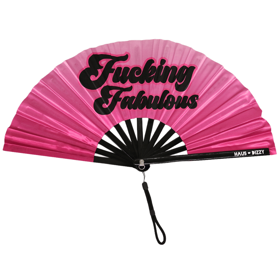 Pink fan with black text that reads 'fucking fabulous' and 'Haus of Dizzy' branding on wood part, fan is on awhite background