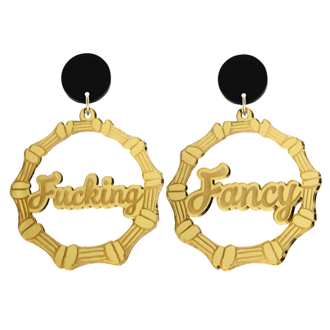 haus of dizzy acrylic gold mirror bamboo hoops with ollie cursive text that reads fucking fancy, one word on each earring, with black circle stud tops size large