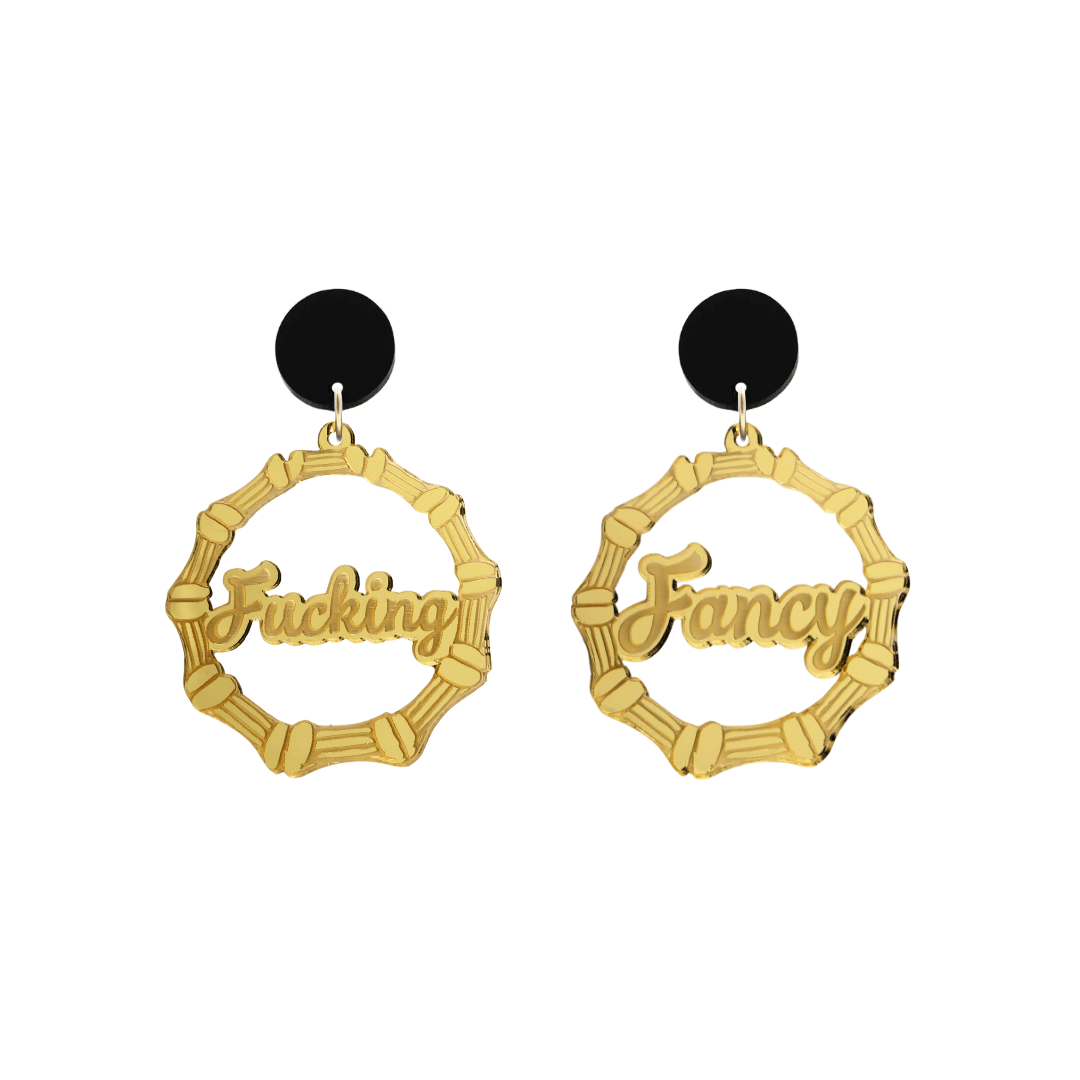 haus of dizzy acrylic gold mirror bamboo hoops with ollie cursive text that reads fucking fancy, one word on each earring, with black circle stud tops size small