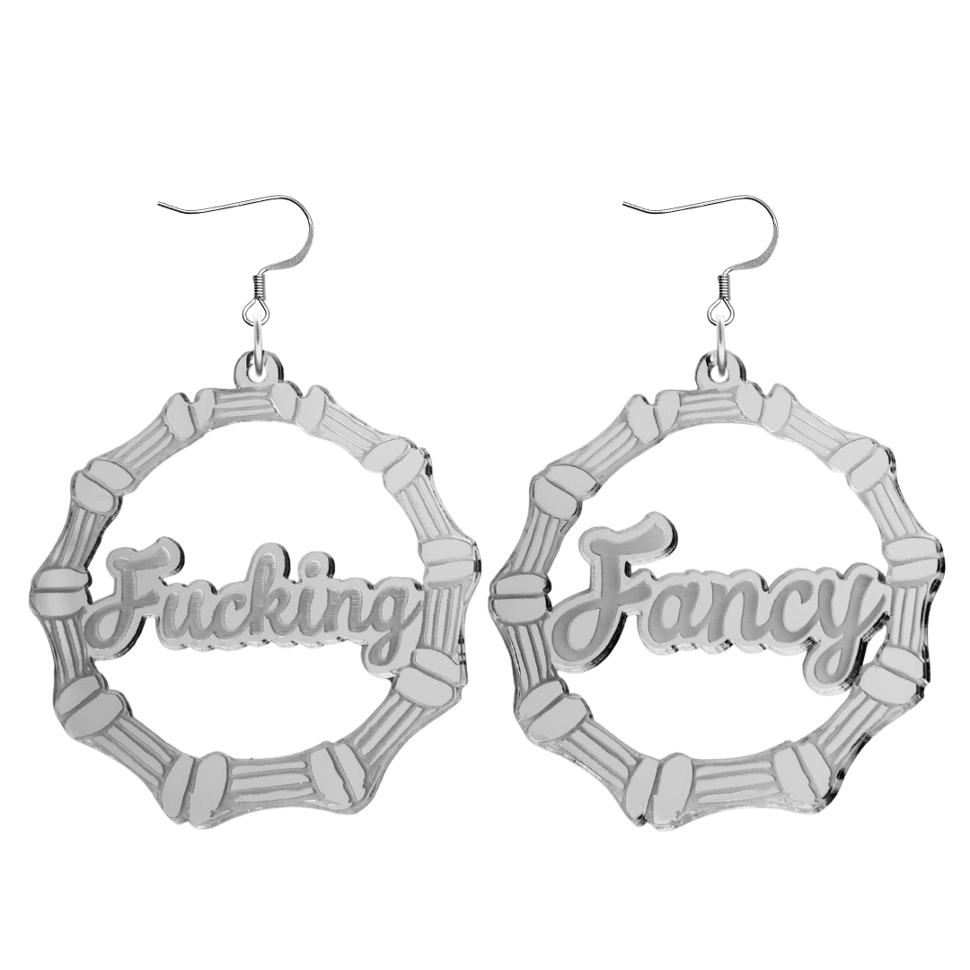 haus of dizzy acrylic silver mirror bamboo hoops with ollie cursive text that reads fucking fancy, one word on each earring, with hooks no circle stud tops size large