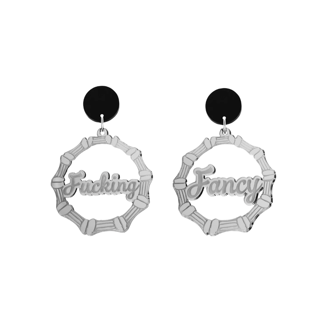 haus of dizzy acrylic silver mirror bamboo hoops with ollie cursive text that reads fucking fancy, one word on each earring, with black circle stud tops size small
