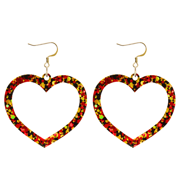 haus of dizzy heart-shaped acrylic earrings with black, red, and gold glitter through clear base with hooks size large