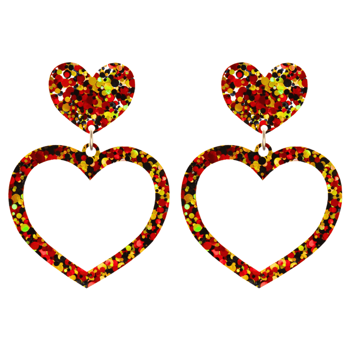 haus of dizzy heart-shaped acrylic earrings with black, red, and gold glitter through clear base with stud tops size large