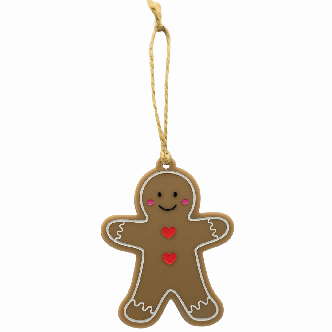 haus of dizzy light brown Gingerbread friend ornament with a black smiley face and red hearts buttons and pink cheeks hung on twine one size