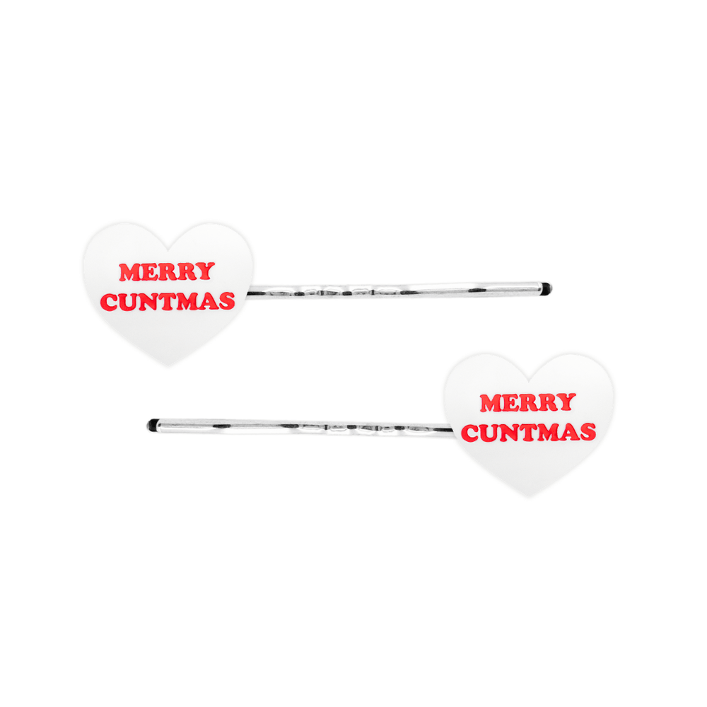 haus of dizzy white heart-shaped acrylic hearts on silver hair pins with red 'MERRY CUNTMAS' text on a white background