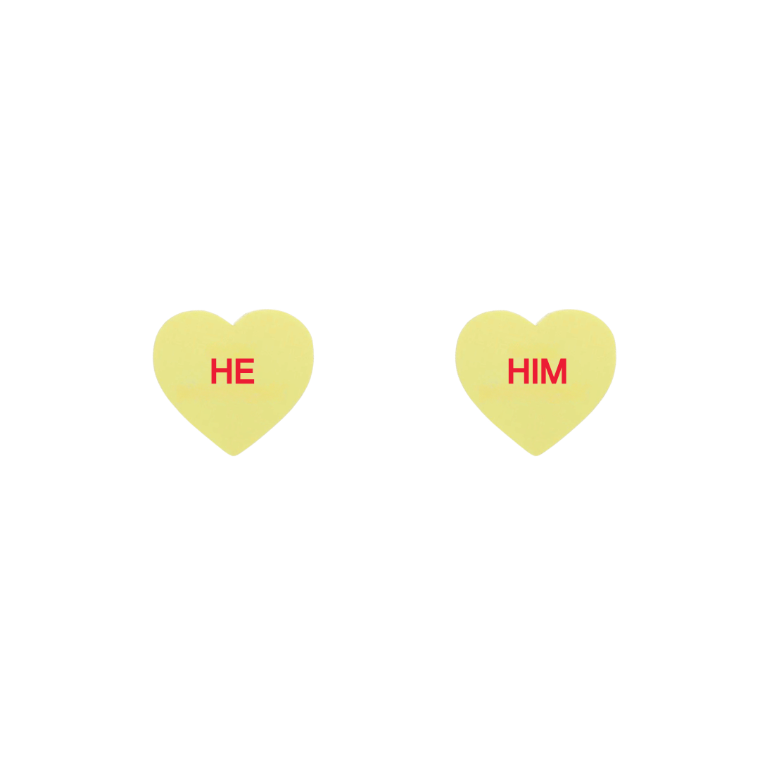 haus of dizzy pastel lemon candy heart studs with pronouns HE and HIM in hand painted red text one word on each stud