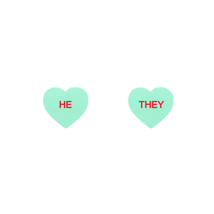 haus of dizzy pastel mint candy heart studs with pronouns HE and THEY in hand painted red text one word on each stud