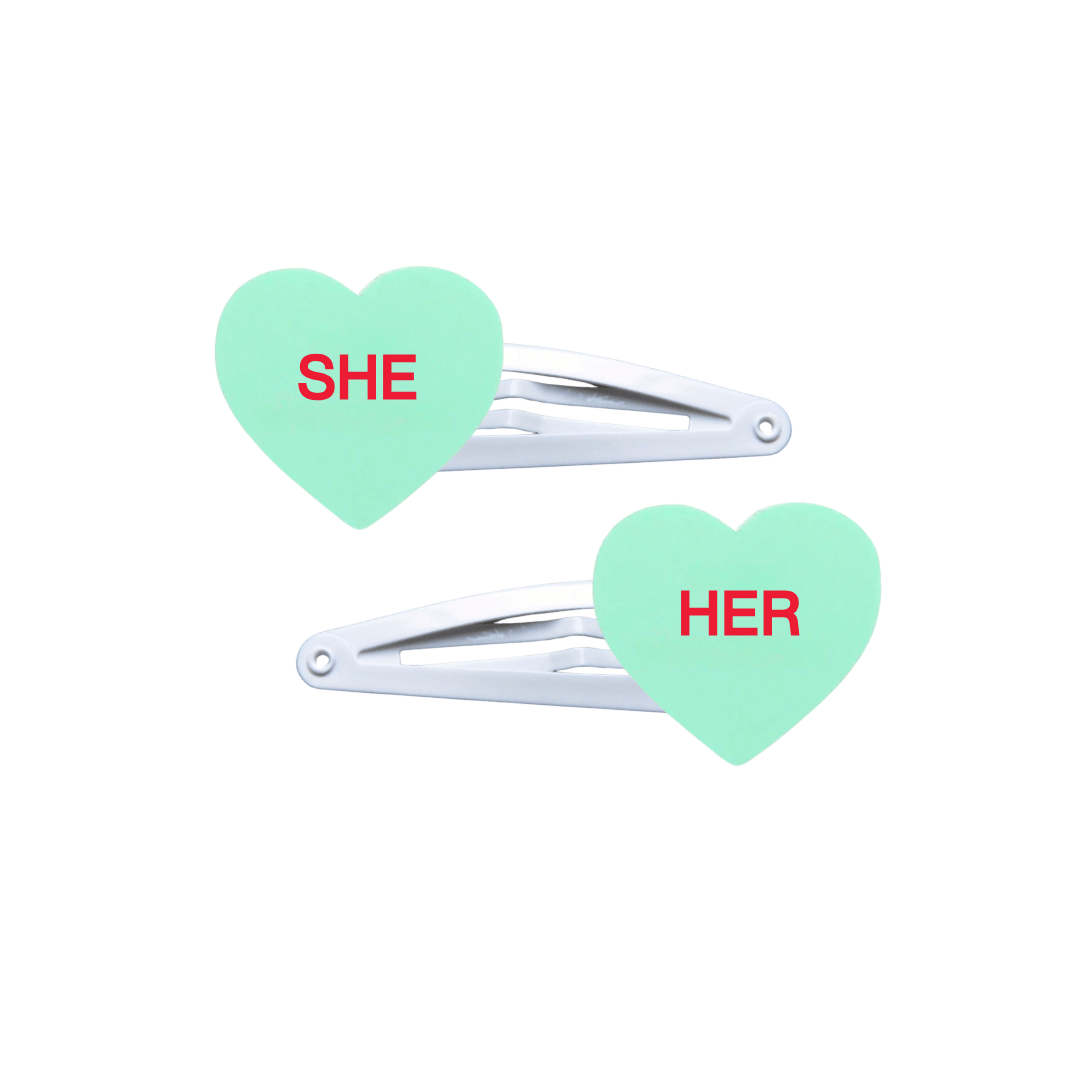 haus of dizzy two pastel mint candy heart acrylic pieces on white hair snap clips with pronouns SHE and HER hand painted red text one word on each hair clip