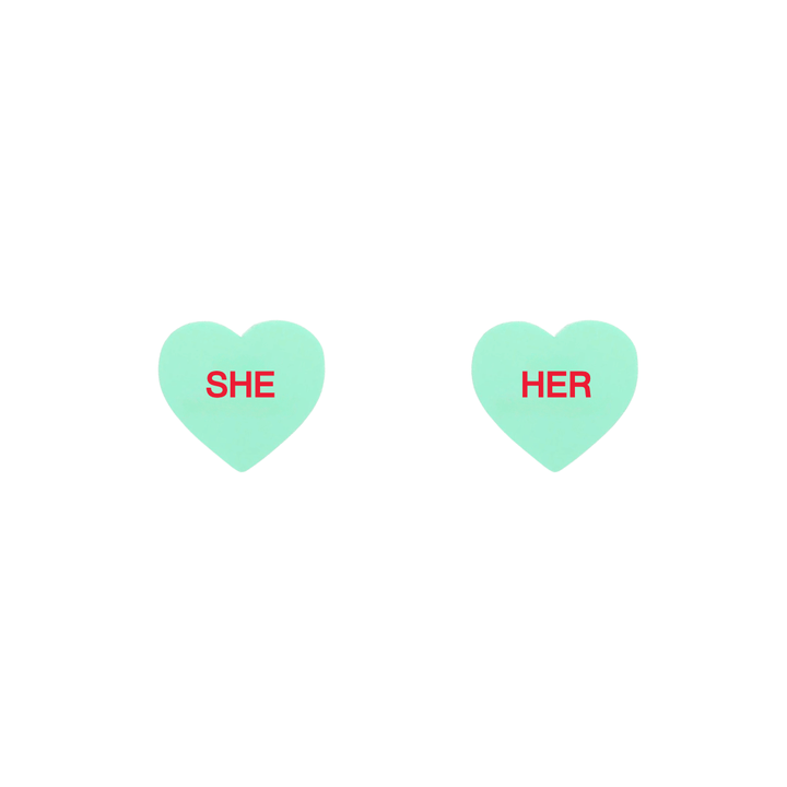 haus of dizzy pastel mint candy heart studs with pronouns SHE and HER in hand painted red text one word on each stud