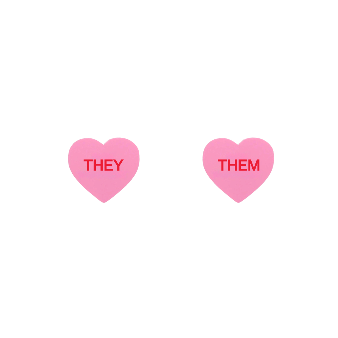 haus of dizzy pastel pink candy heart studs with pronouns THEY and THEM in hand painted red text one word on each stud